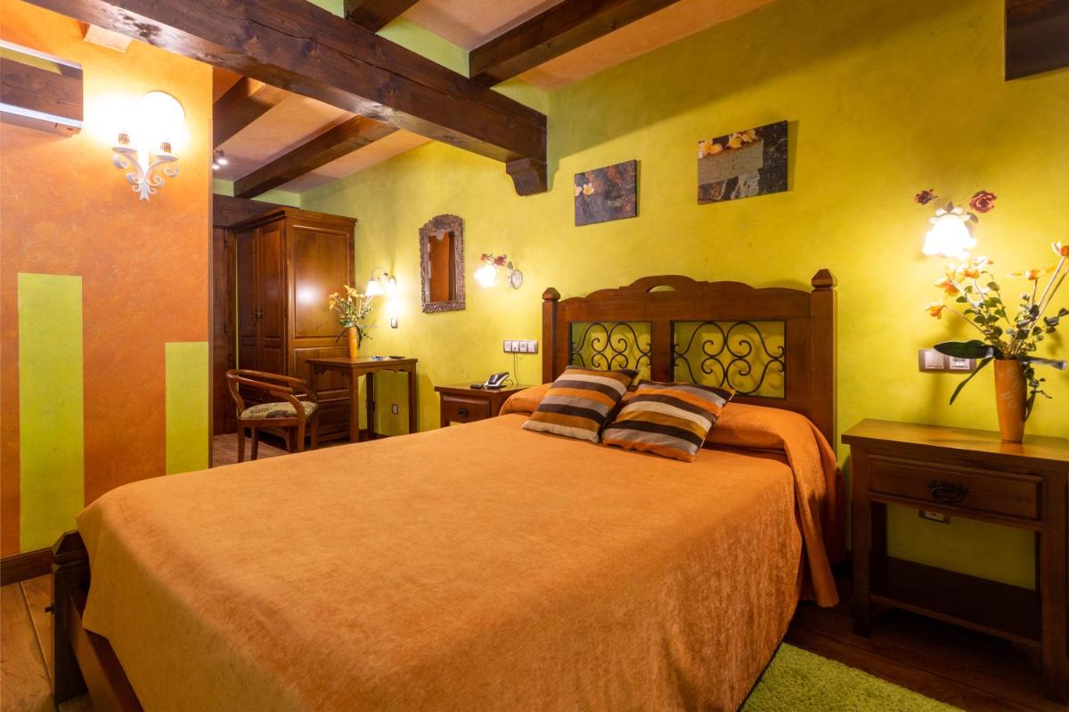 Cama o camas de una habitación en Hotel Spa Casona La Hondonada