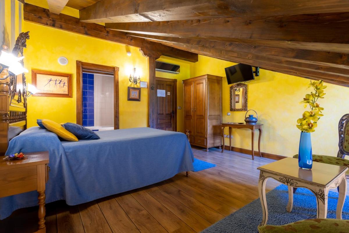 Cama o camas de una habitación en Hotel Spa Casona La Hondonada