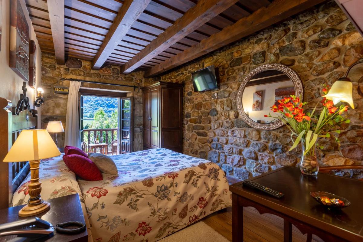 Cama o camas de una habitación en Hotel Spa Casona La Hondonada