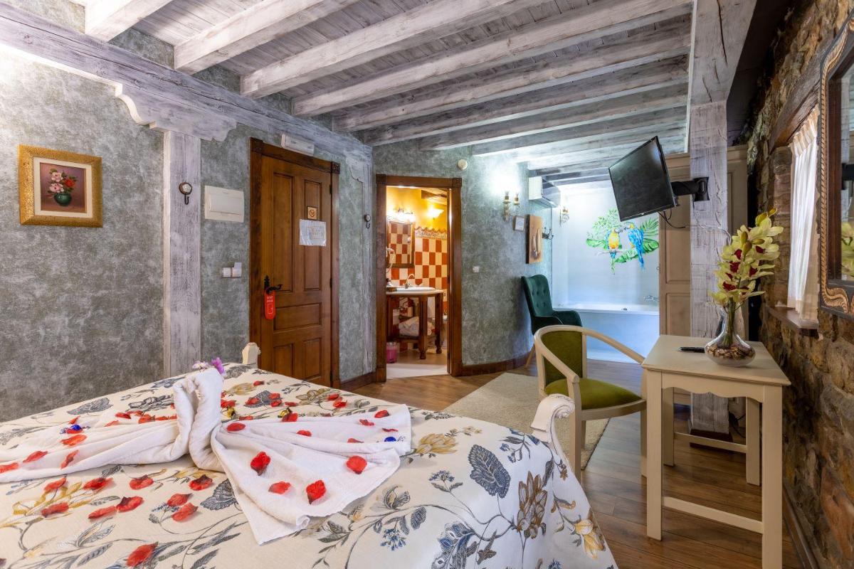 Cama o camas de una habitación en Hotel Spa Casona La Hondonada