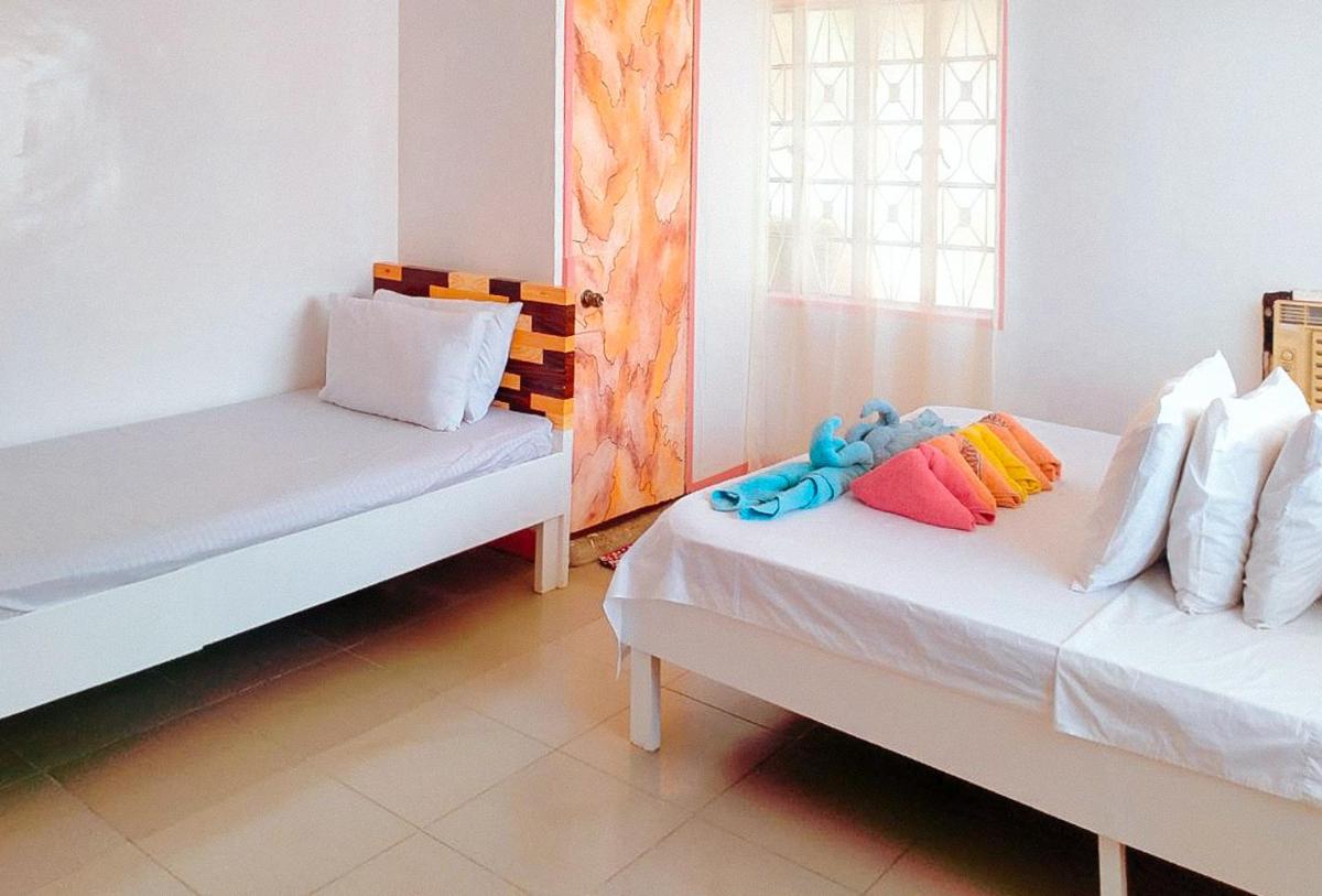 RedDoorz @ Jmalls Island Tourist Inn Dinagat Island - Housity