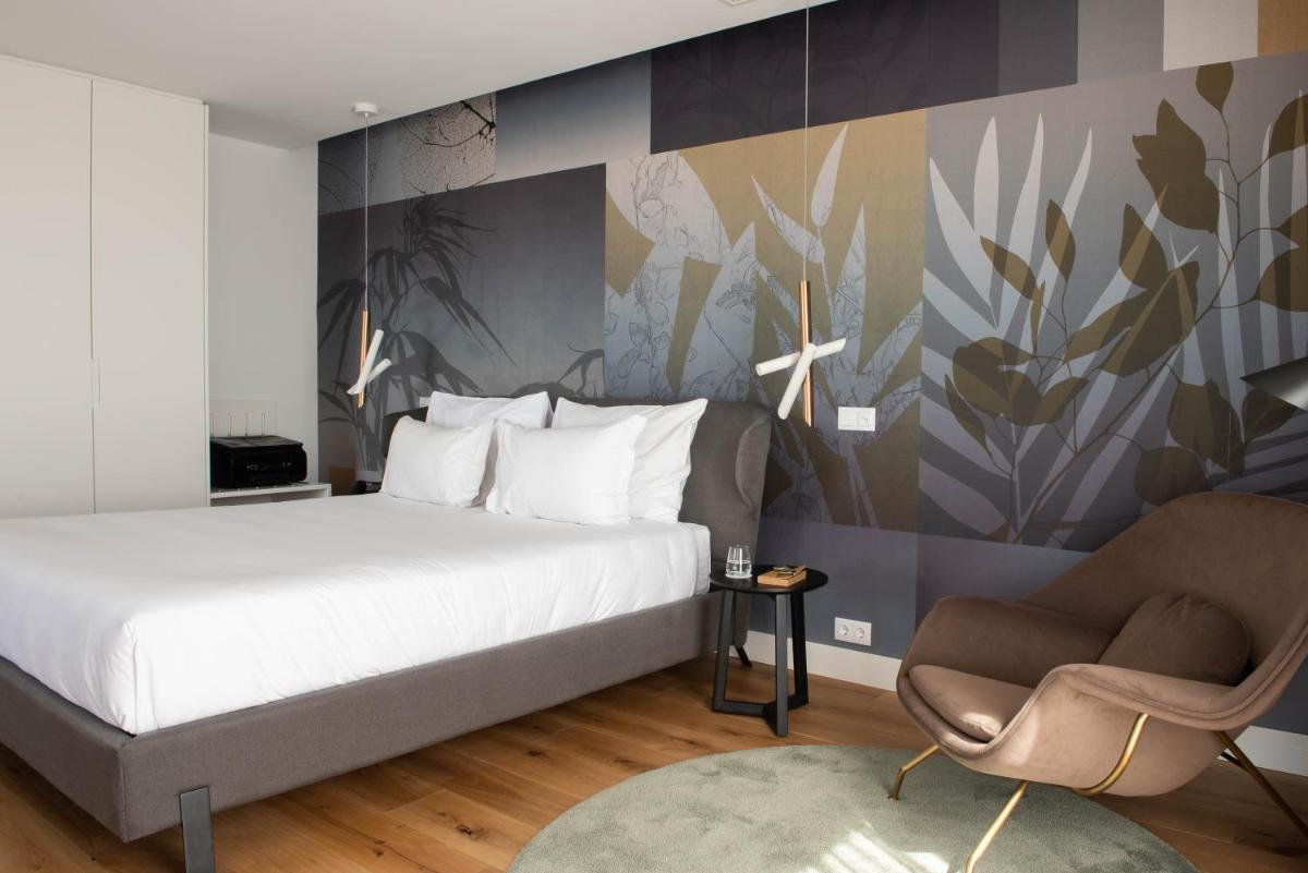 Uma cama ou camas num quarto em Sines Sea View Business & Leisure Hotel