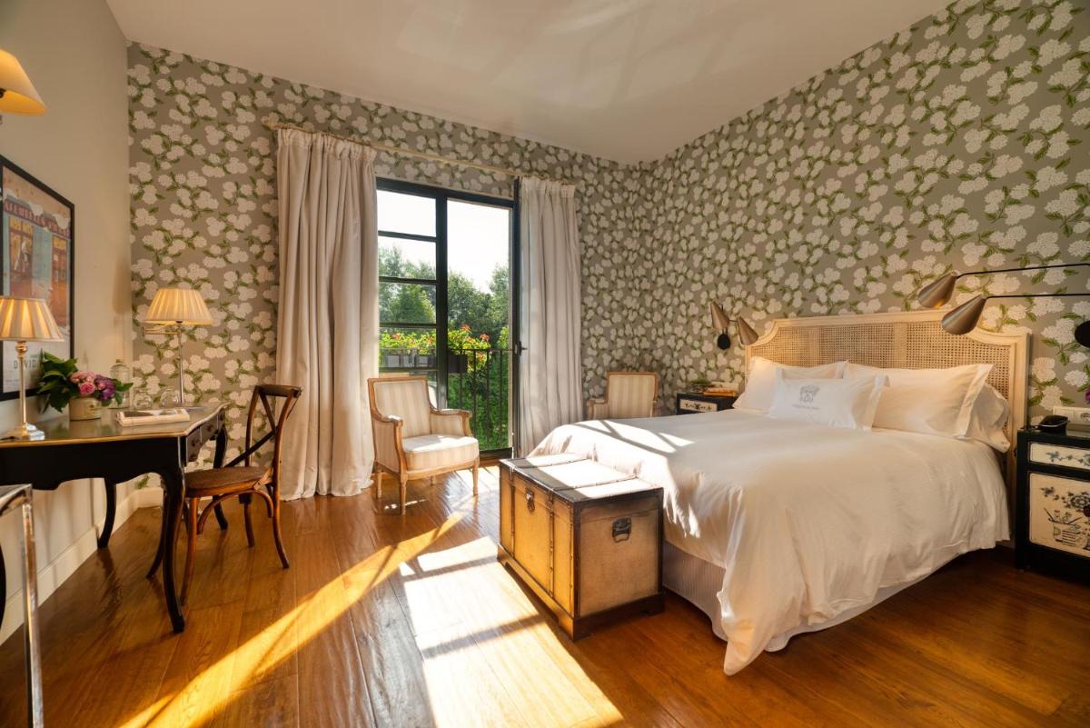 Cama o camas de una habitación en A Quinta Da Auga Hotel Spa Relais & Chateaux