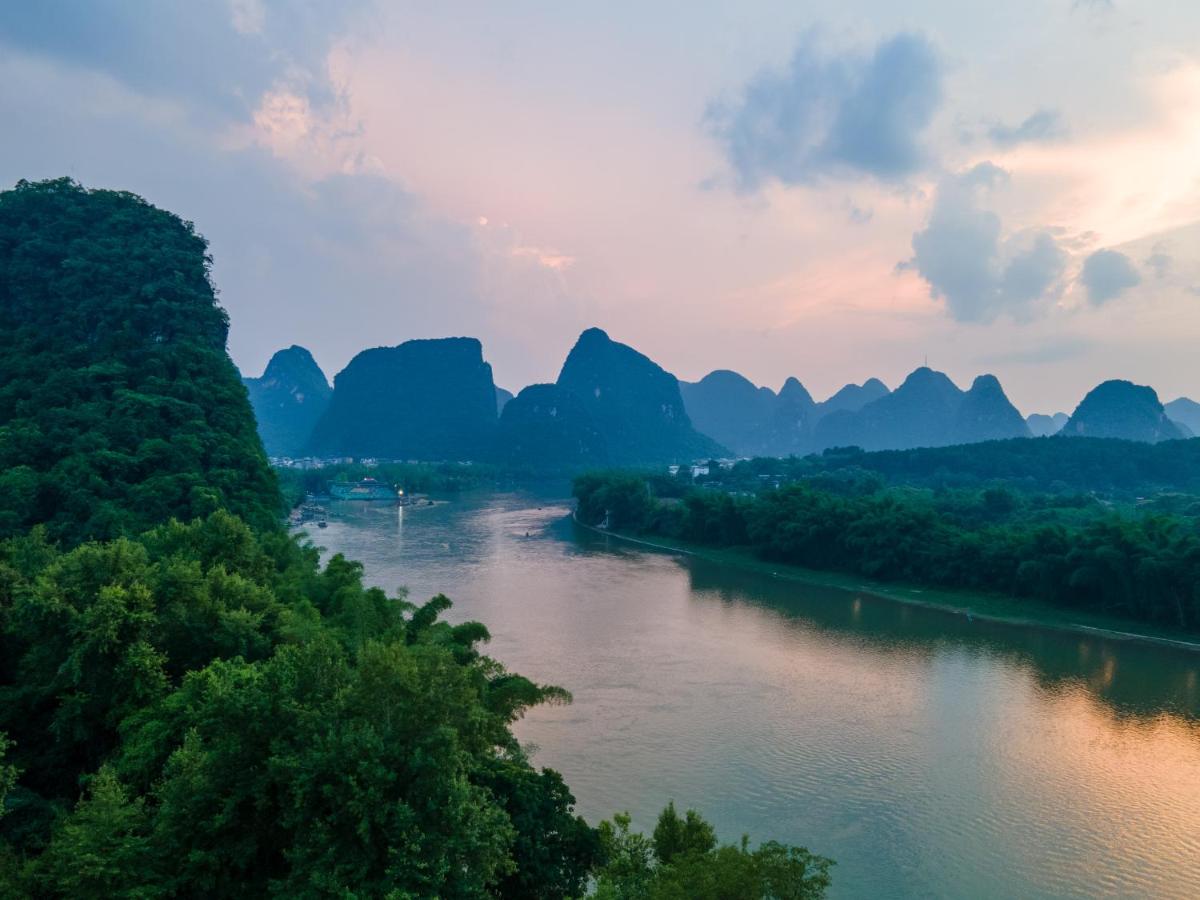 Yangshuo River Lodge Hotel-Free pick up from Yangshuo Area over three nights - Housity