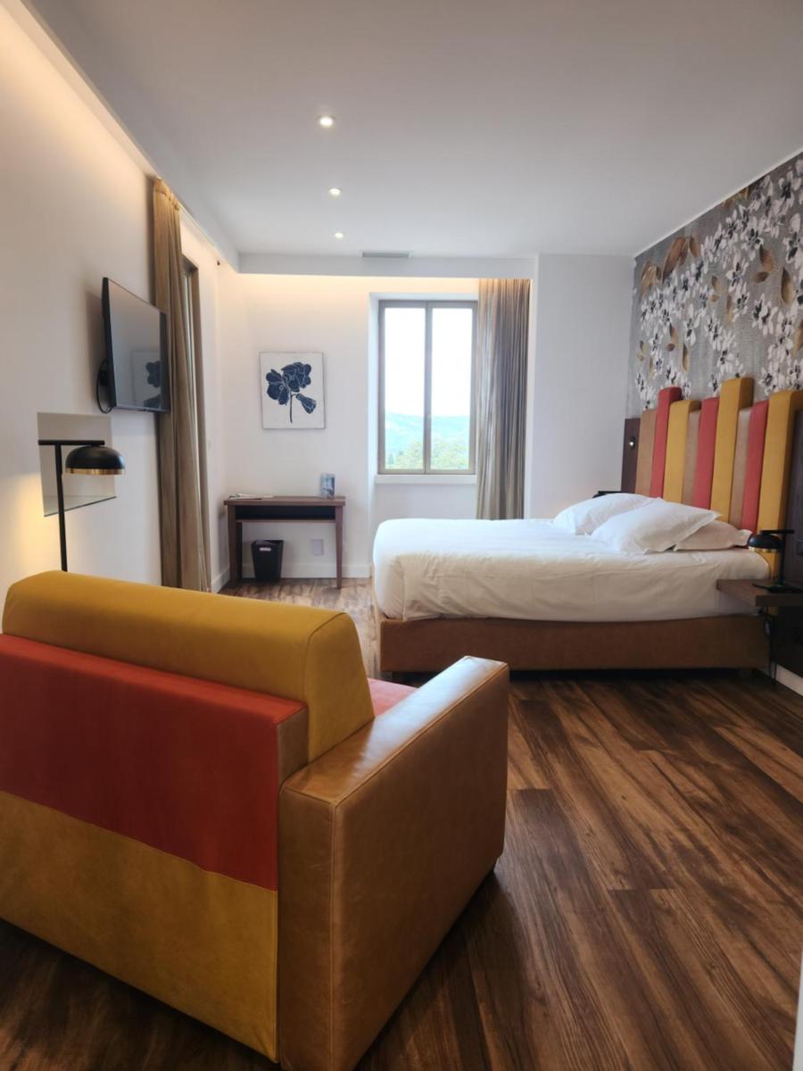 Un ou plusieurs lits dans un hébergement de l'établissement Hôtel Casale Olmia
