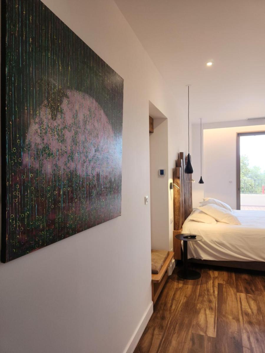 Un ou plusieurs lits dans un hébergement de l'établissement Hôtel Casale Olmia