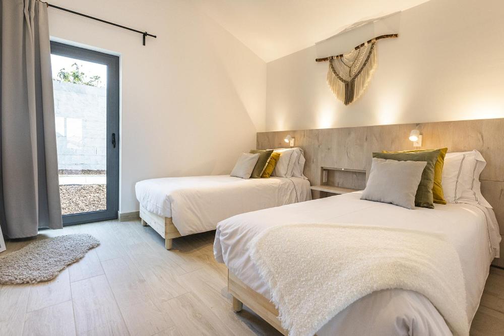 Uma cama ou camas num quarto em Real Abadia, Congress & Spa Hotel