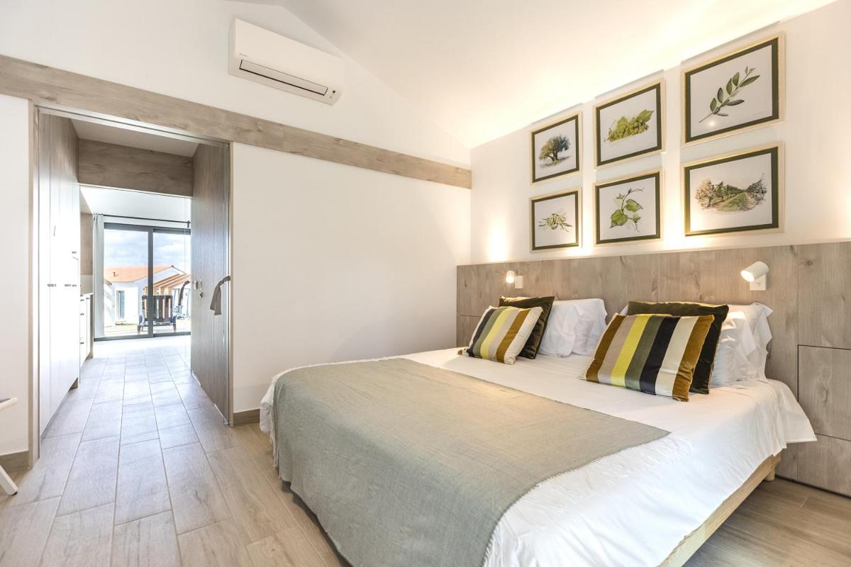 Uma cama ou camas num quarto em Real Abadia, Congress & Spa Hotel