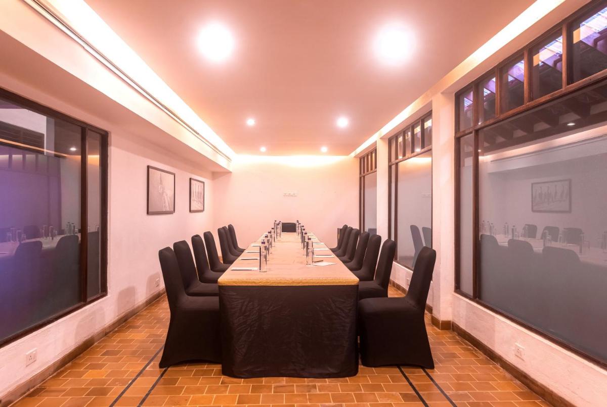 a conference room with a long table and chairs at Casino Hotel - CGH Earth, Cochin in Cochin