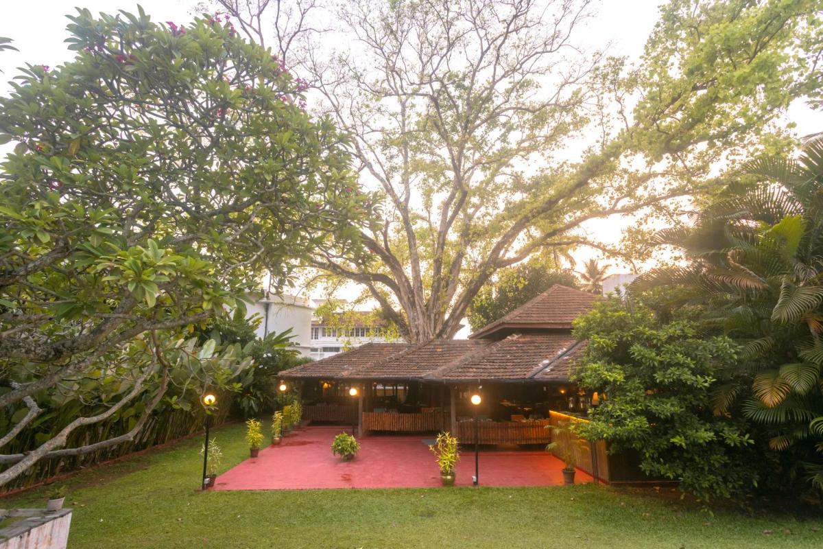 a house with a red carpet in front of it at Casino Hotel - CGH Earth, Cochin in Cochin