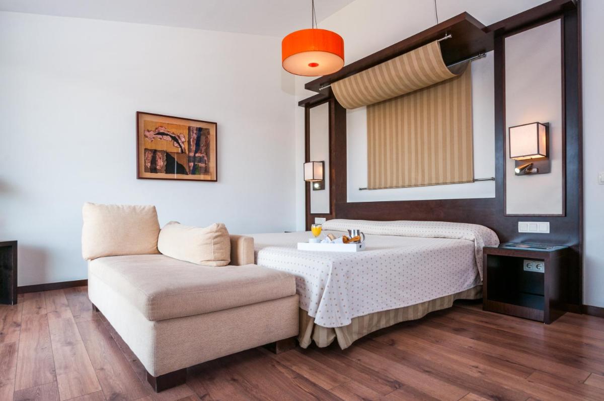 Cama o camas de una habitación en Hotel Isla de La Garena