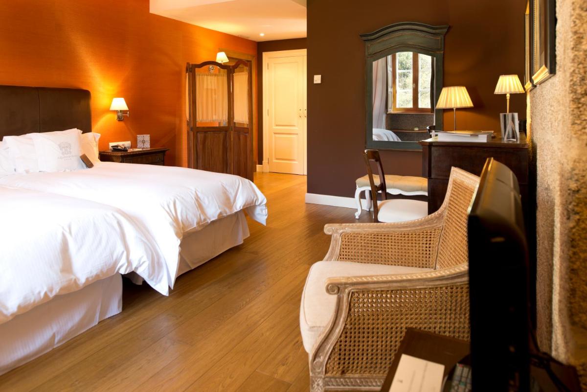Cama o camas de una habitación en A Quinta Da Auga Hotel Spa Relais & Chateaux