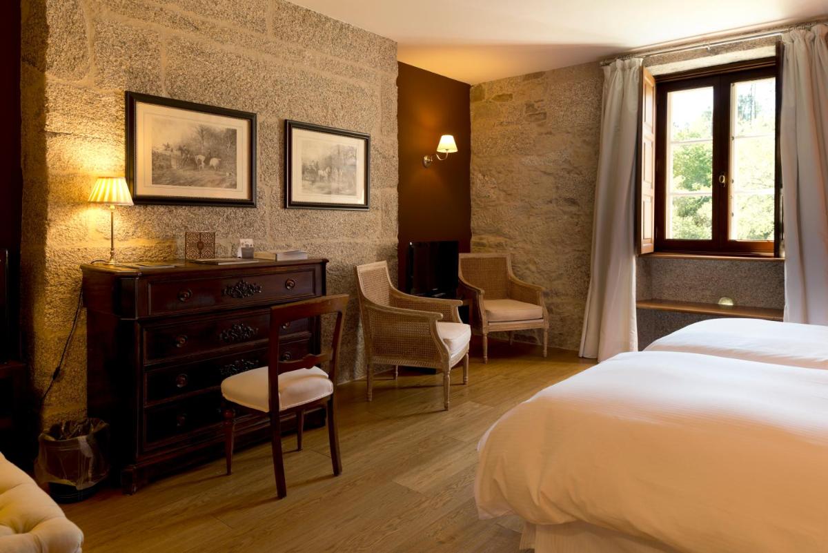 Cama o camas de una habitación en A Quinta Da Auga Hotel Spa Relais & Chateaux