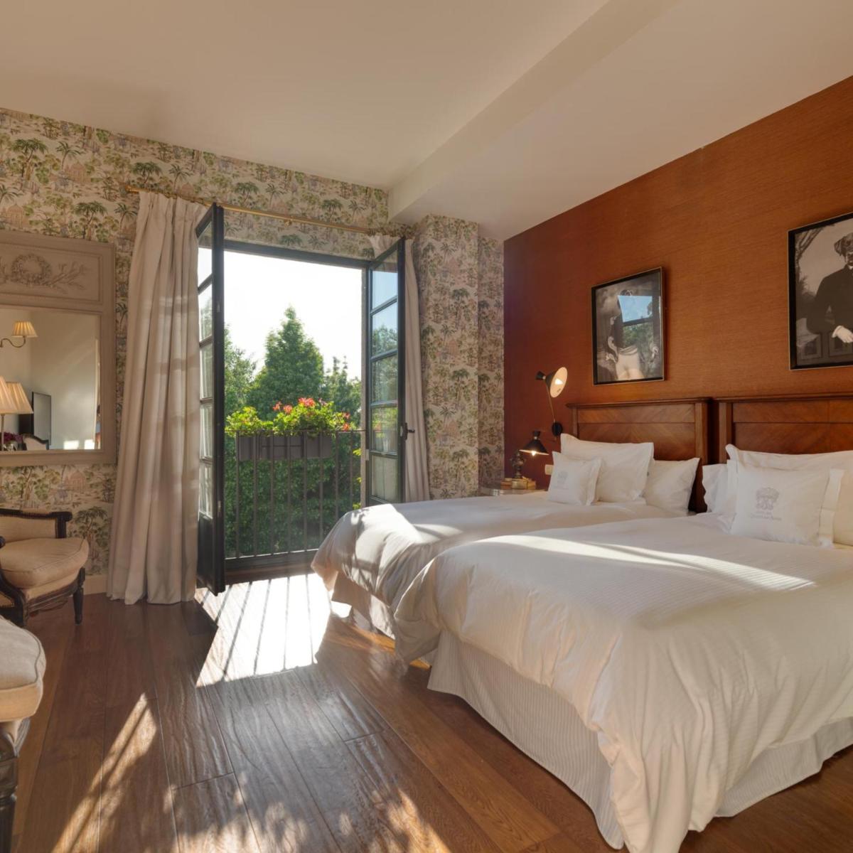 Cama o camas de una habitación en A Quinta Da Auga Hotel Spa Relais & Chateaux