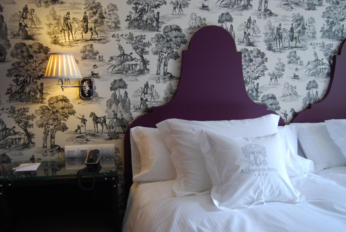 Cama o camas de una habitación en A Quinta Da Auga Hotel Spa Relais & Chateaux