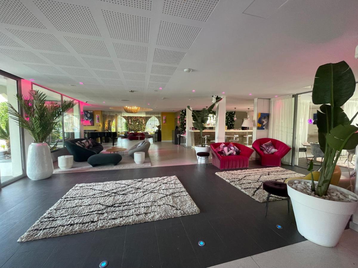 Coin salon dans l'établissement Oz'Inn Hôtel & Spa