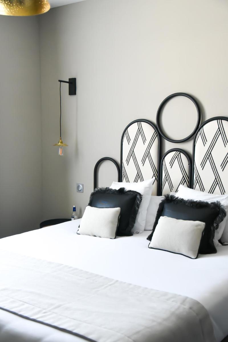 Un ou plusieurs lits dans un hébergement de l'établissement Le Général d'Elbée Hotel & Spa - Teritoria