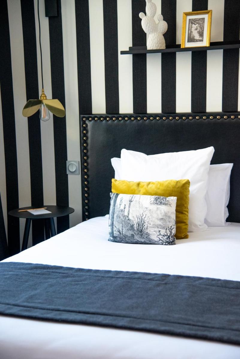 Un ou plusieurs lits dans un hébergement de l'établissement Le Général d'Elbée Hotel & Spa - Teritoria