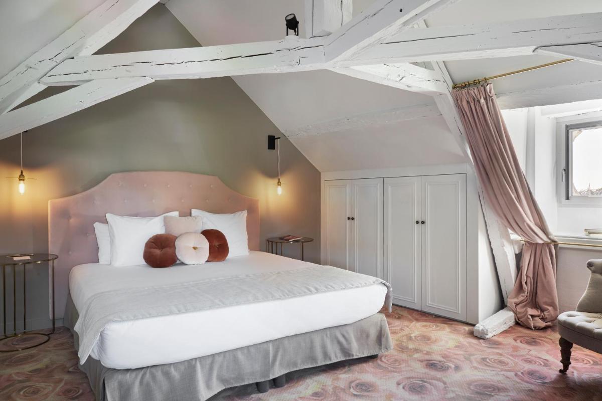 Un ou plusieurs lits dans un hébergement de l'établissement Le Général d'Elbée Hotel & Spa - Teritoria