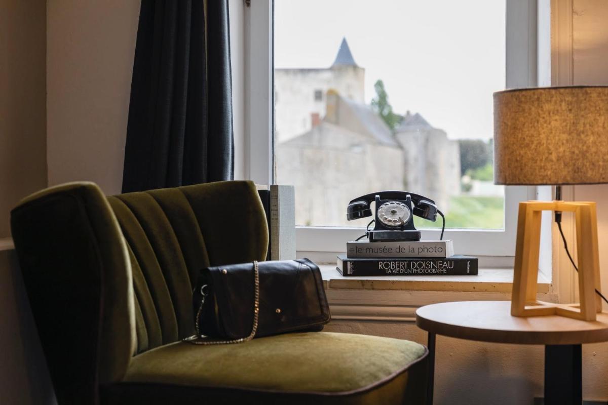 Coin salon dans l'établissement Le Général d'Elbée Hotel & Spa - Teritoria