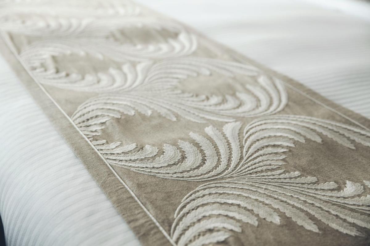 a close up of a white pattern on a table at The Anya Hotel-Golf Course Road in Gurgaon