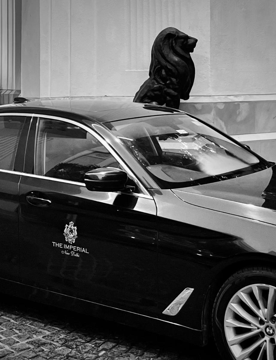 a car with a black dog sitting on the roof at The Imperial, New Delhi in New Delhi a car with a black dog sitting on the roof at The Imperial, New Delhi in New Delhi