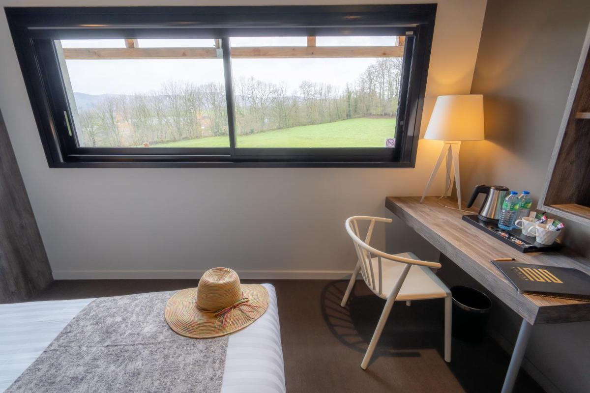 Un ou plusieurs lits dans un hébergement de l'établissement Mildiss Hotel Spa & Restaurant, BW Signature Collection