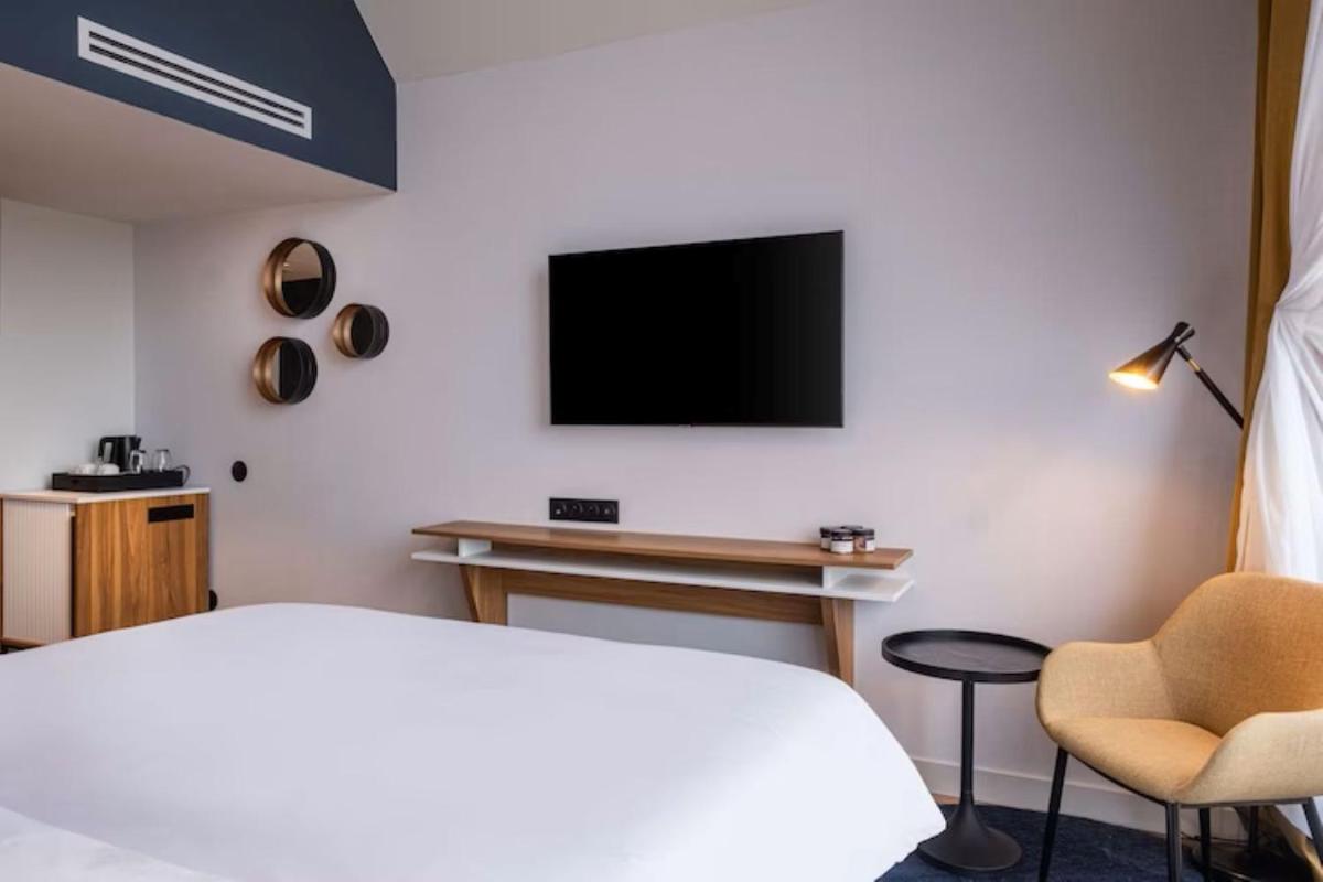 Télévision ou salle de divertissement dans l'établissement Radisson Blu Grand Hotel & Spa, Malo-Les-Bains
