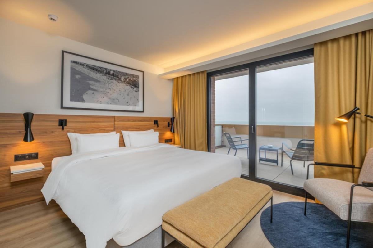 Un ou plusieurs lits dans un hébergement de l'établissement Radisson Blu Grand Hotel & Spa, Malo-Les-Bains