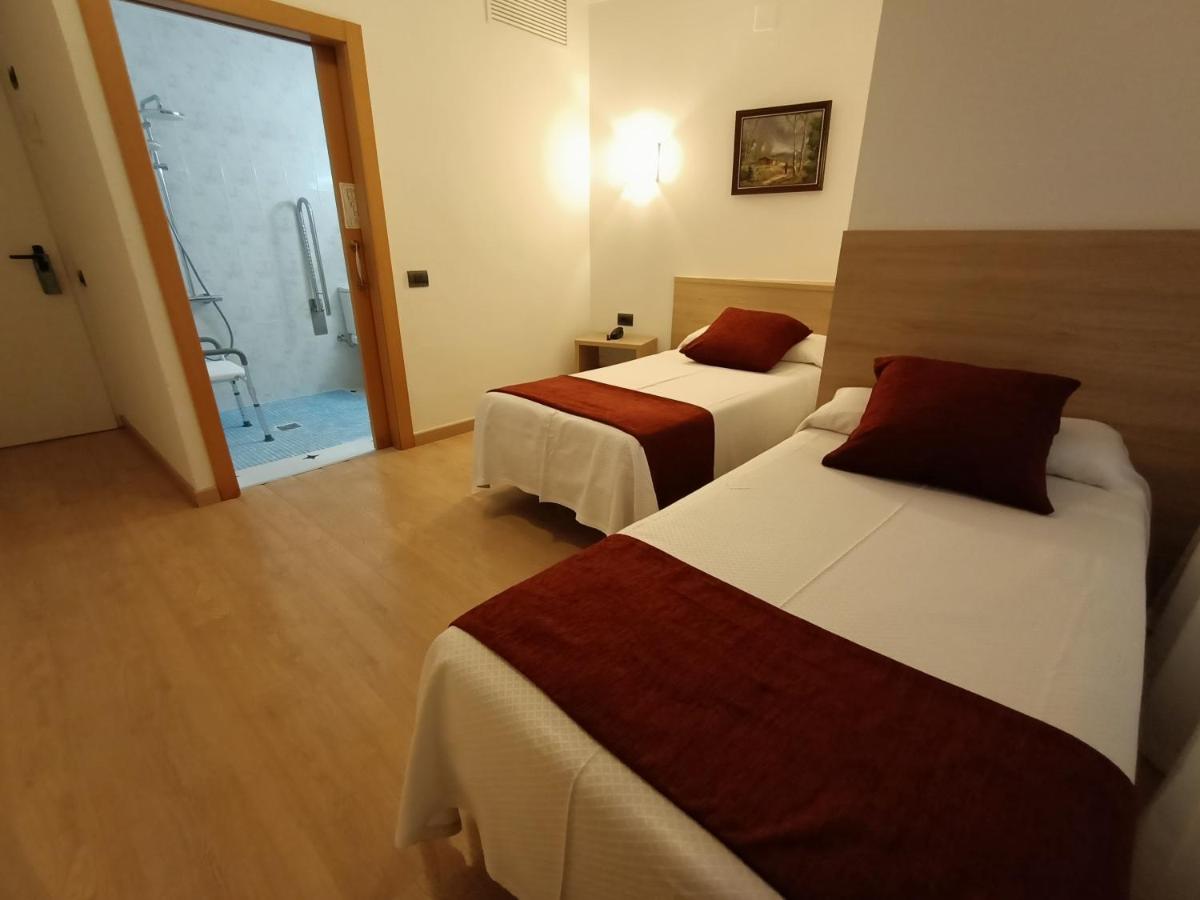 Cama o camas de una habitación en Hotel Vilobi
