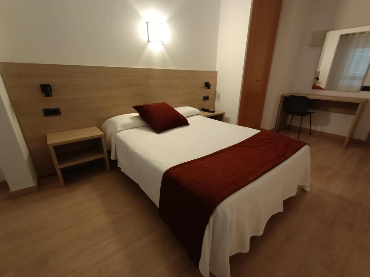 Cama o camas de una habitación en Hotel Vilobi