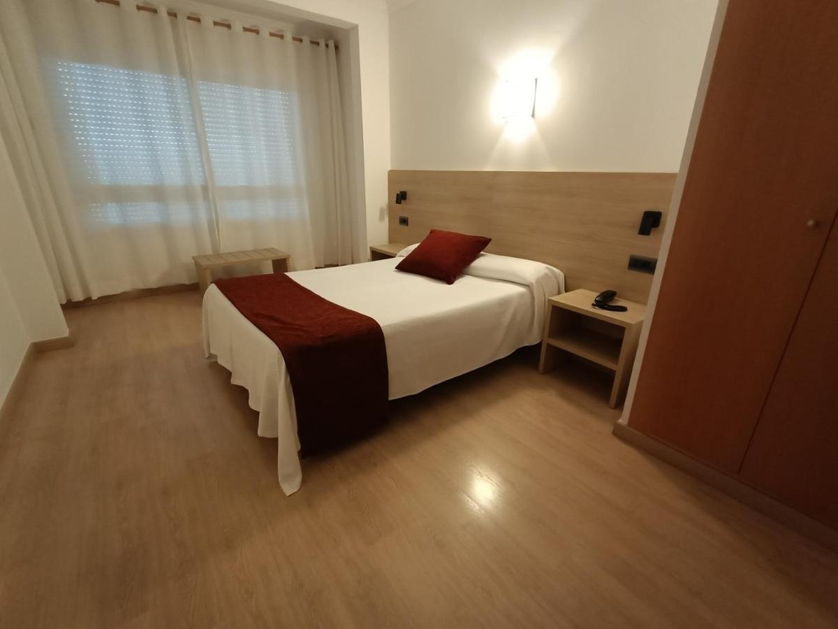 Cama o camas de una habitación en Hotel Vilobi