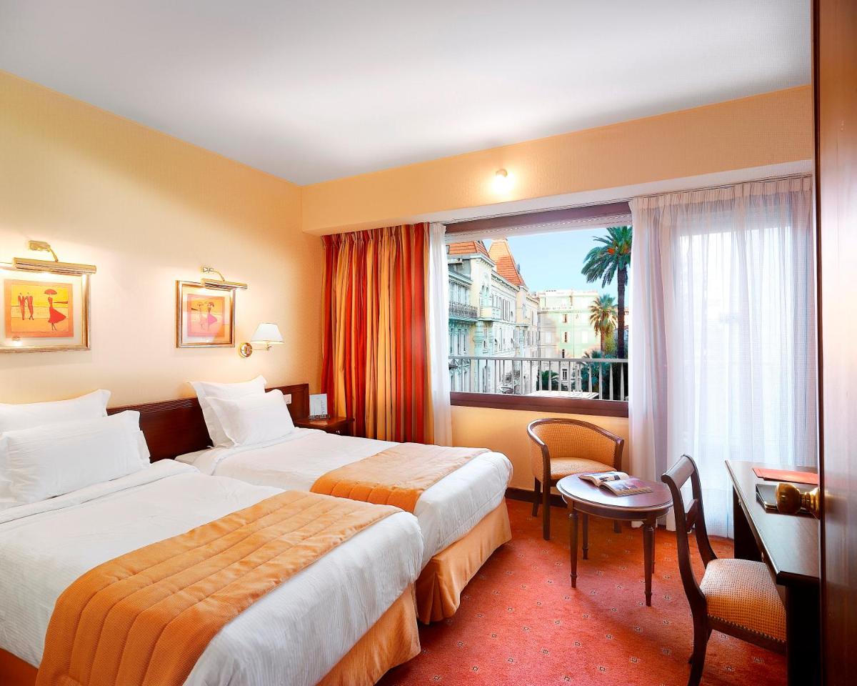 Un ou plusieurs lits dans un hébergement de l'établissement Splendid Hotel & Spa Nice
