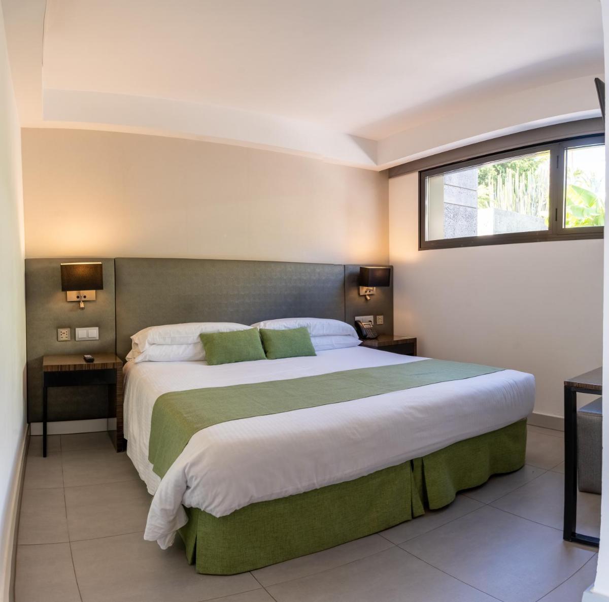 Cama o camas de una habitación en La Isla y el Mar, Hotel Boutique