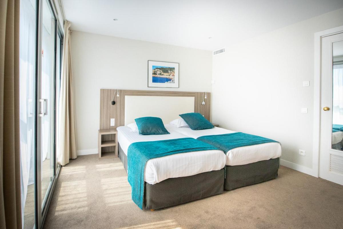 Un ou plusieurs lits dans un hébergement de l'établissement Splendid Hotel & Spa Nice