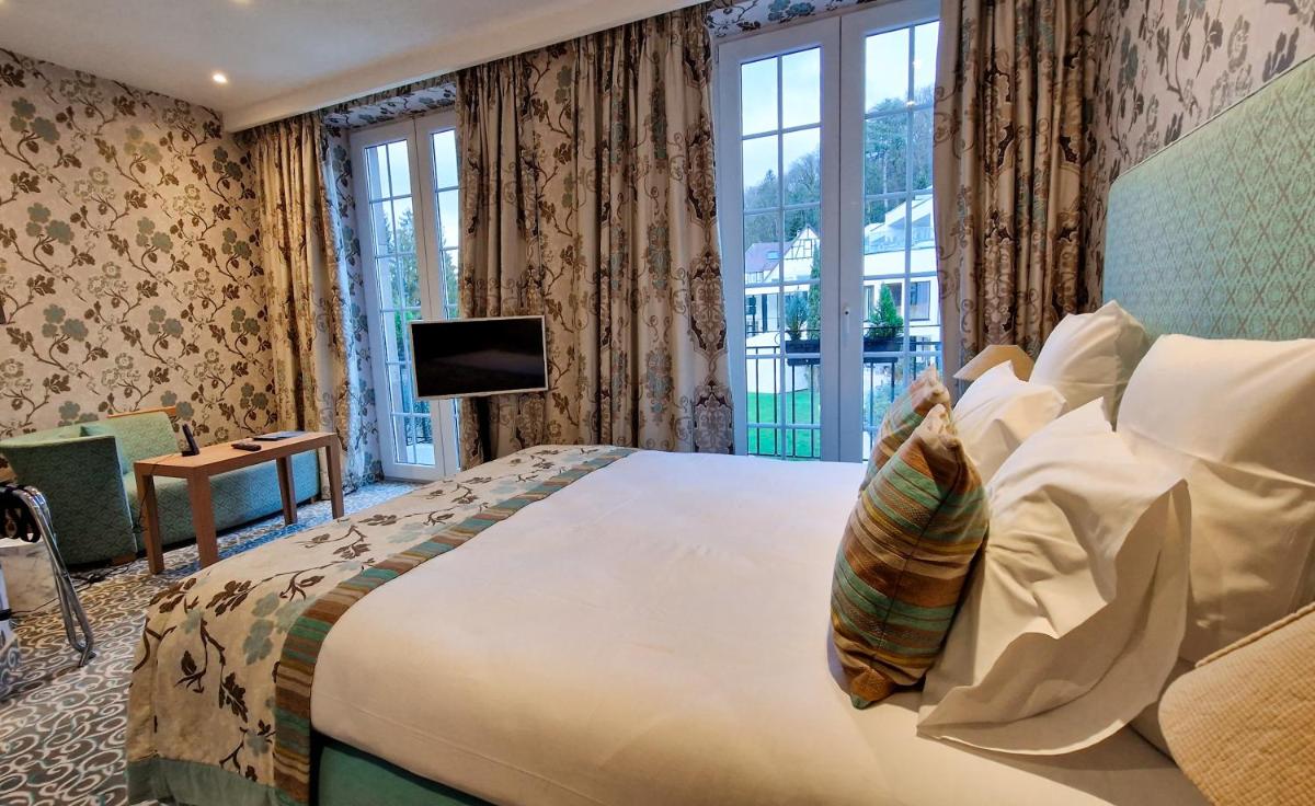 Un ou plusieurs lits dans un hébergement de l'établissement 6717 Nature Hôtel & Spa Le Clos des Délices