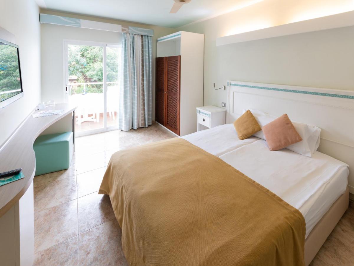 Cama o camas de una habitación en Hotel Bahia del Sol