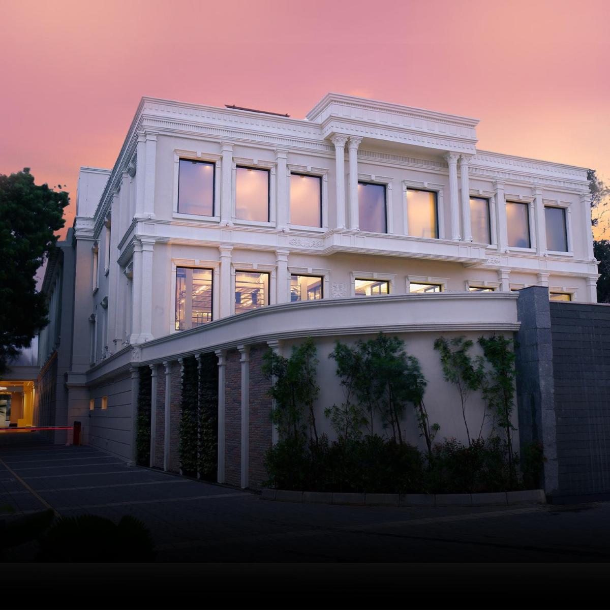 a white building with a lot of windows at Radisson Blu Hotel & Suites GRT Chennai in Chennai
