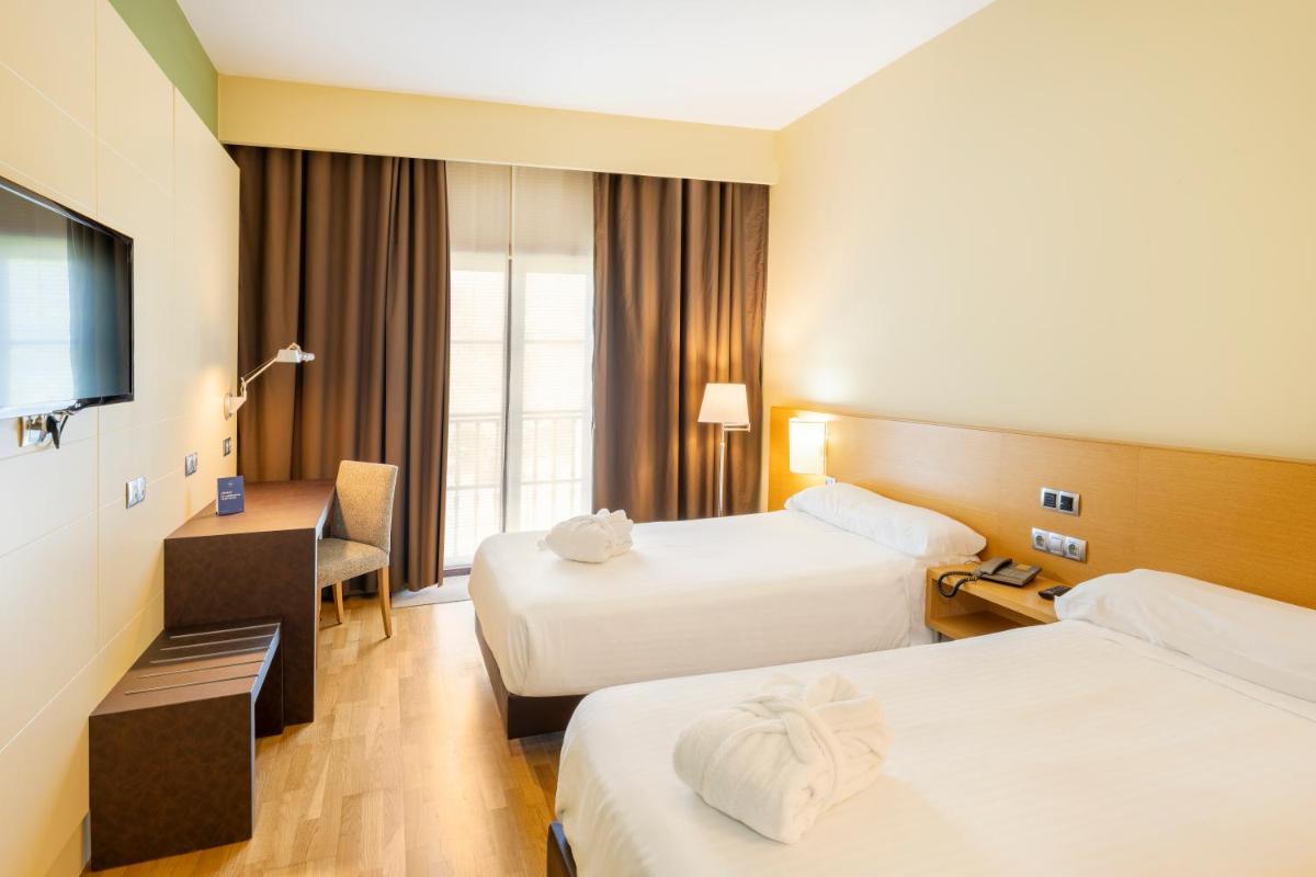 Cama o camas de una habitación en IBERIK Augas Santas Balneario & Golf