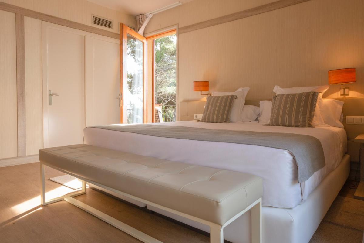 Cama o camas de una habitación en Hotel Santa Marta