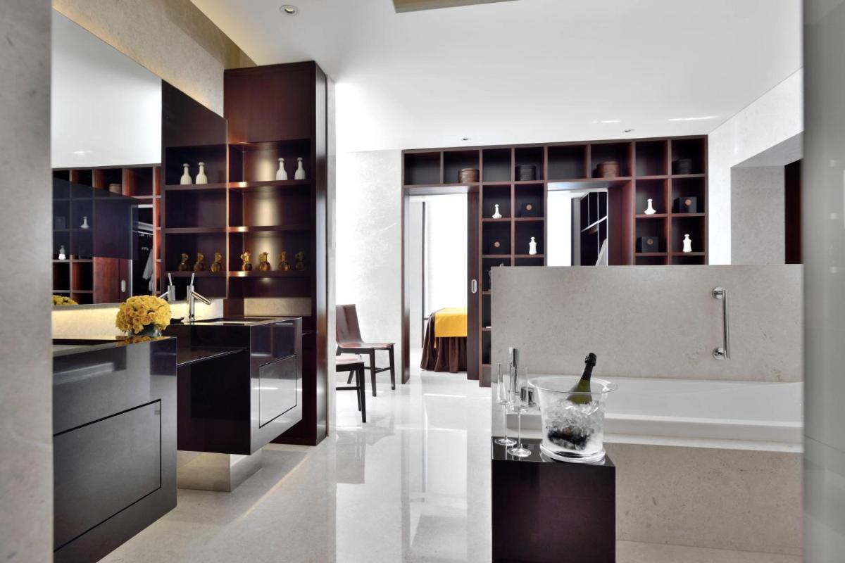 a kitchen with a bottle of wine on a counter at JW Marriott Pune in Pune