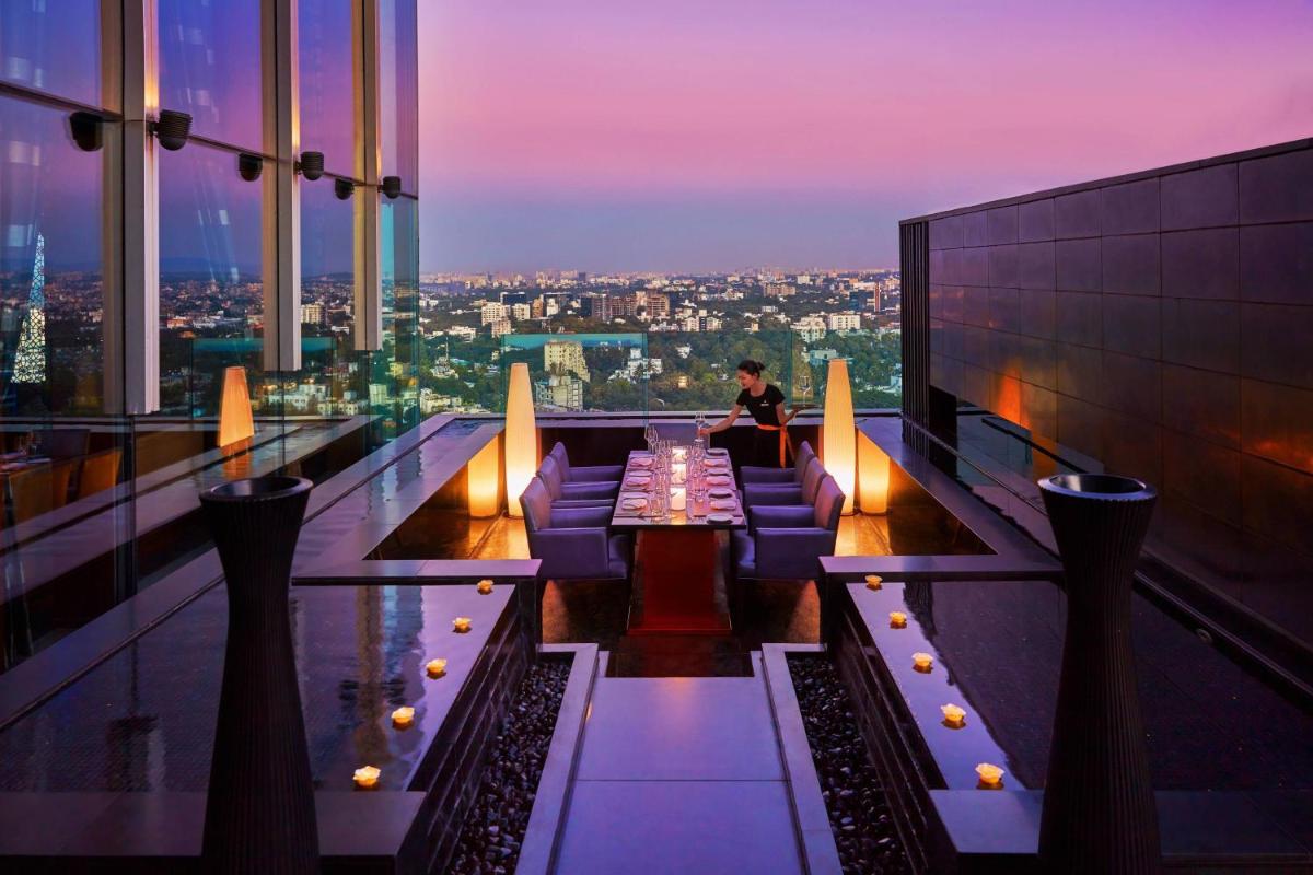 a bar on the top of a building with a view at JW Marriott Pune in Pune