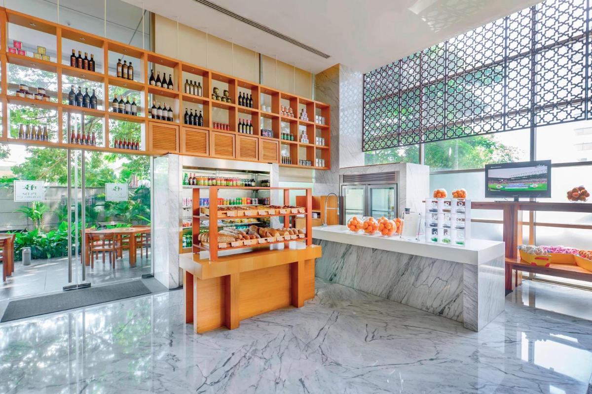 a store with a counter with bottles of wine at JW Marriott Pune in Pune
