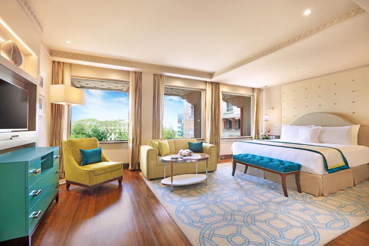 a hotel room with a bed and a television at ITC Maratha, a Luxury Collection Hotel, Mumbai in Mumbai