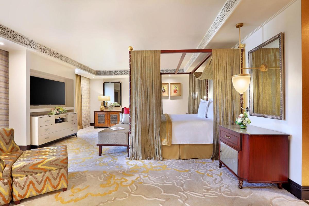 a hotel room with a bed and a television at ITC Maratha, a Luxury Collection Hotel, Mumbai in Mumbai
