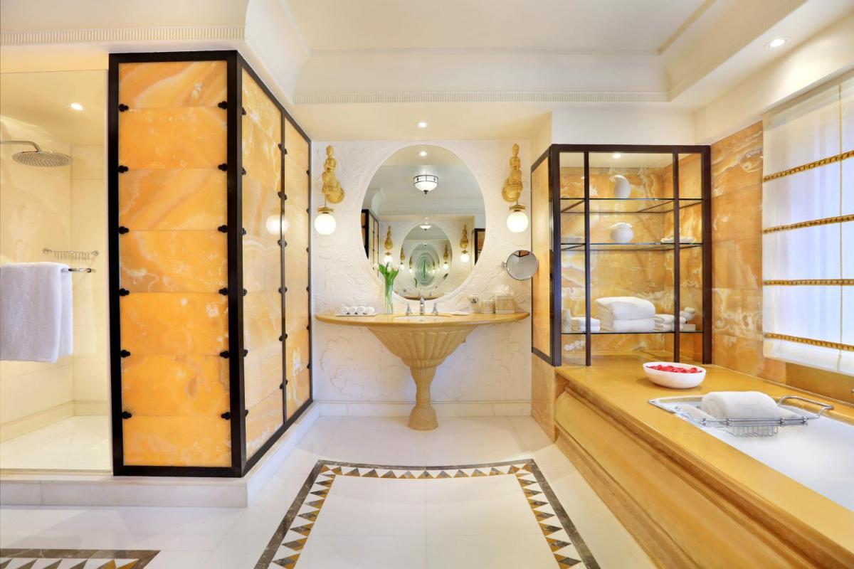 a bathroom with a large mirror and a sink at ITC Maratha, a Luxury Collection Hotel, Mumbai in Mumbai