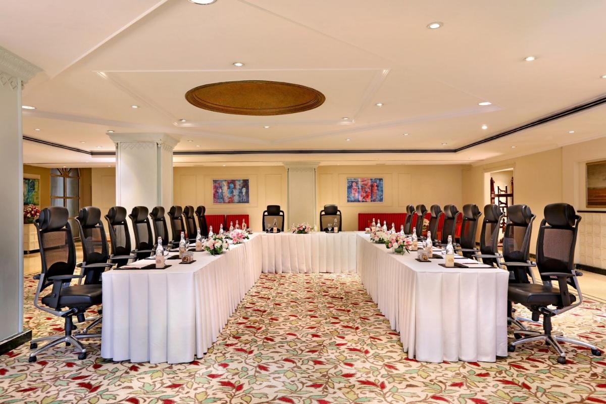 a set of tables and chairs in a room at ITC Maratha, a Luxury Collection Hotel, Mumbai in Mumbai