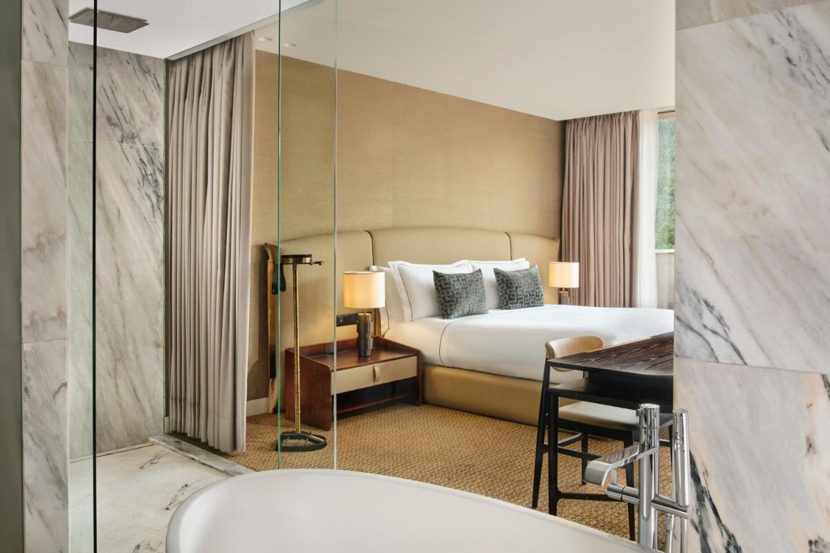Uma cama ou camas num quarto em Penha Longa Resort
