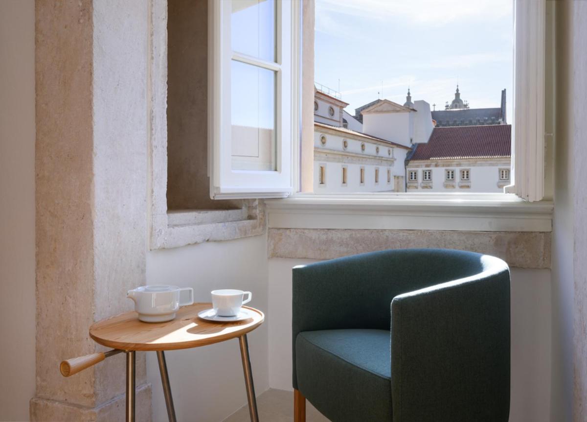 Uma área de estar em Montebelo Mosteiro de Alcobaça Historic Hotel