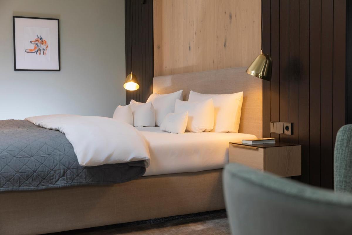 Ein Bett oder Betten in einem Zimmer der Unterkunft Wellness & Genuss Resort - Engel Obertal